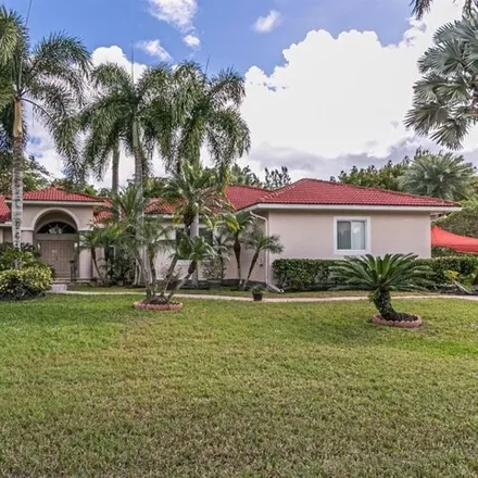 Buy this 4 bed house on 1574 Northwest 114th Terrace in Plantation Acres, Plantation