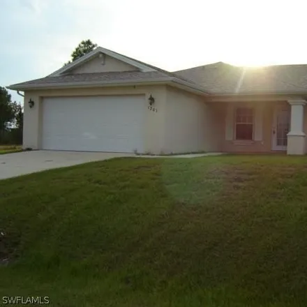 Rent this 3 bed house on 1203 Robert Avenue in Lehigh Acres, FL 33972