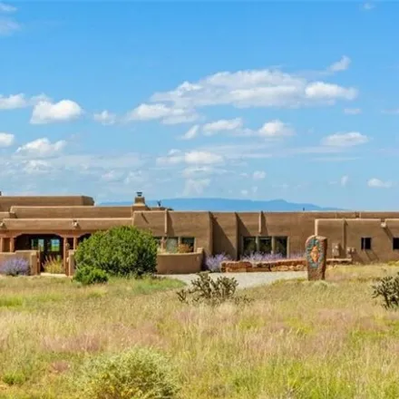 Buy this 4 bed house on Cielo Tranquilo Court in Santa Fe County, NM 87594