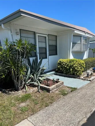 Rent this 2 bed house on 166 Thatch Palm Street East in Baskin, Largo