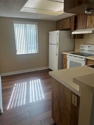 Rent this 2 bed condo on 219 Cypress Lane in Palm Harbor, FL 34677