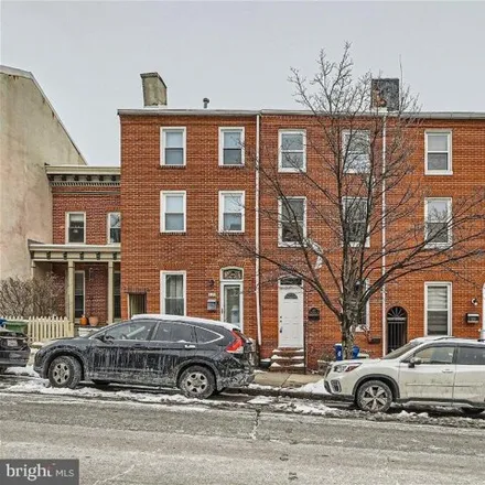 Rent this 3 bed townhouse on 227 South Washington Street in Baltimore, MD 21231