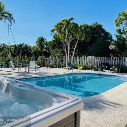 Rent this 4 bed house on 2401 Andros Lane in Riverland, Fort Lauderdale