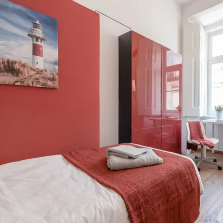 Rent this 4 bed room on Rua dos Sapateiros 207 in 1100-576 Lisbon, Portugal
