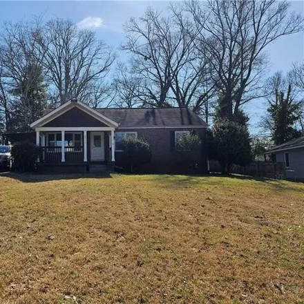 Rent this 3 bed house on 2511 East Tupelo Street Southeast in Candler-McAfee, GA 30317