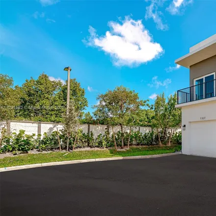 Rent this 3 bed townhouse on 1316 Northwest 27th Avenue in Collier Park, Pompano Beach