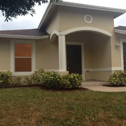 Rent this 3 bed house on 150 Walker Ave in Greenacres, Florida