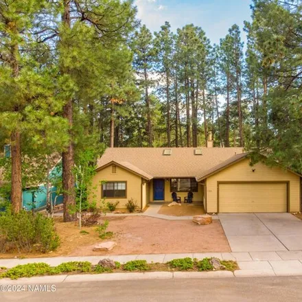 Buy this 3 bed house on 1703 W Sunshine Dr in Flagstaff, Arizona