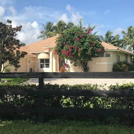 Rent this 4 bed house on Oatland Ct in West Palm Beach, FL