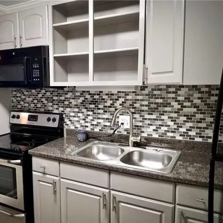 Rent this 2 bed townhouse on 4335 Cedar Springs Road in Dallas, TX 75235
