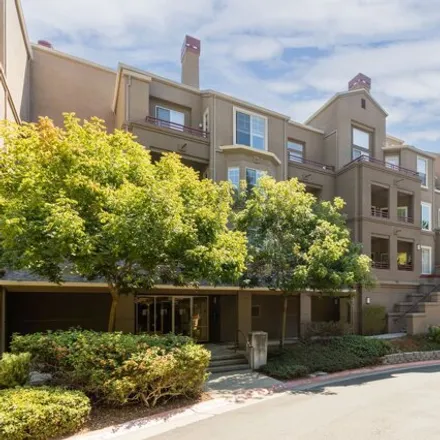 Rent this 2 bed condo on 240 Caldecott Ln Unit 108 in Oakland, California