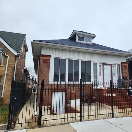 Buy this 5 bed house on 6612 South Mozart Street in Chicago, IL 60629