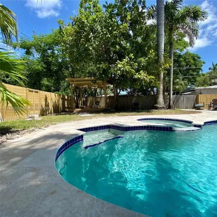 Rent this 4 bed house on 1555 Fletcher Street in Hollywood, FL 33020