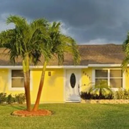 Buy this 3 bed house on 2575 Southwest Dawn Street in Port Saint Lucie, FL 34953