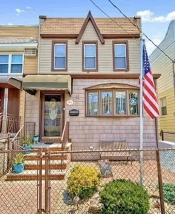 Buy this 5 bed house on 66-29 75th Street in New York, NY 11379