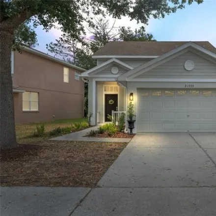 Buy this 4 bed house on 21339 Morning Mist Way in Land O Lakes, Florida