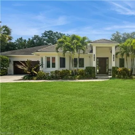 Buy this 4 bed house on 7019 Oakmont Parkway in Pelican Bay, FL 34108