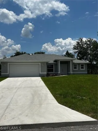 Buy this 3 bed house on 1312 Mckinley Ave in Lehigh Acres, Florida