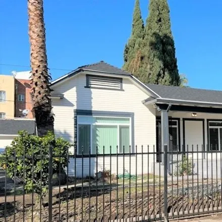 Rent this 4 bed house on 1077 S Norton Ave in Los Angeles, California
