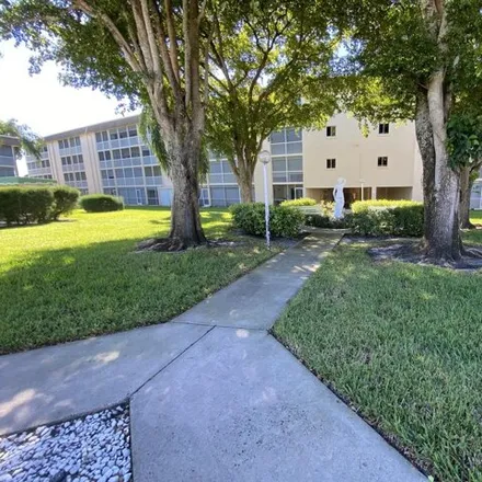 Rent this 1 bed condo on 300 Village Green Circle South in Palm Springs, FL 33461