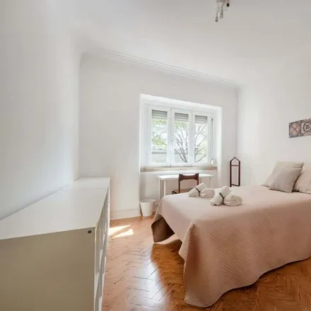 Rent this 7 bed room on Rua João de Menezes 13 in 1900-024 Lisbon, Portugal