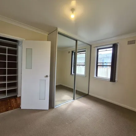 Rent this 3 bed apartment on Lurnea Public School in Sullivan Avenue, Lurnea NSW 2170