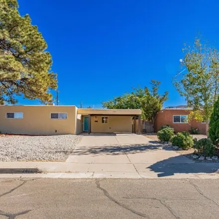 Buy this 4 bed house on 2404 Cagua Drive Northeast in Albuquerque, NM 87110