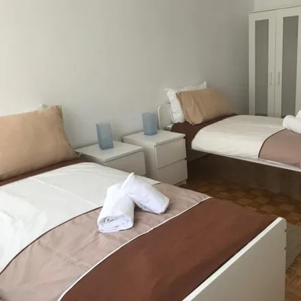 Rent this 8 bed room on Rua Ferreira de Castro 333 in 1950-136 Lisbon, Portugal