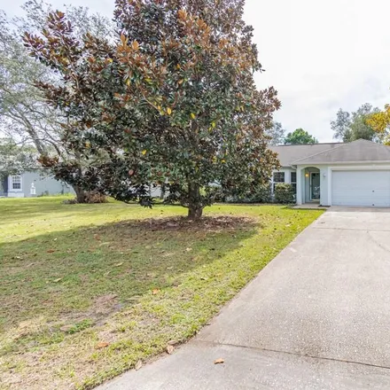 Buy this 4 bed house on 1365 Gold Road in Spring Hill, FL 34609