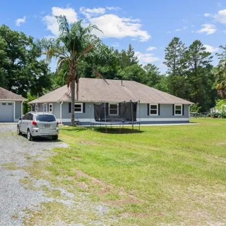 Buy this 4 bed house on 16468 Northwest 92nd Lane in Alachua County, FL 32615