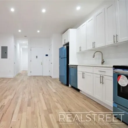 Rent this 4 bed house on 966 Seneca Avenue in New York, NY 11385