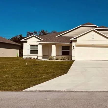 Rent this 4 bed house on 1557 Sw Medley Ln in Port Saint Lucie, Florida