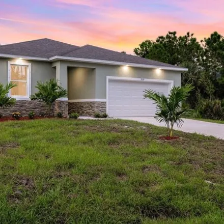 Buy this 4 bed house on 1059 Tide Road Southeast in Palm Bay, FL 32909