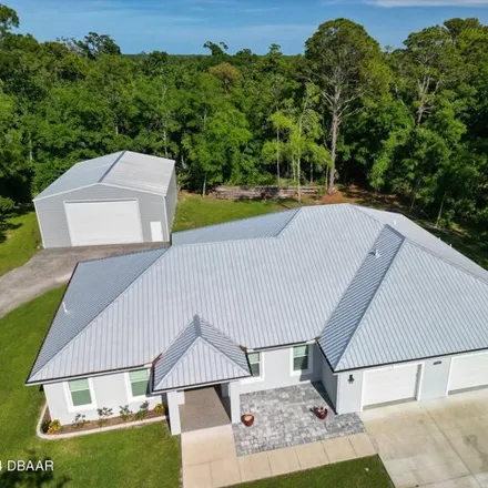 Buy this 3 bed house on 1101 Sugar Mill Drive in Sugar Mill Estates, New Smyrna Beach