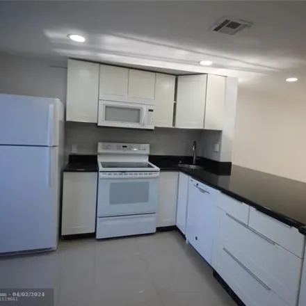 Rent this 2 bed house on 2568 Northeast 15th Street in Country Club Isles, Pompano Beach