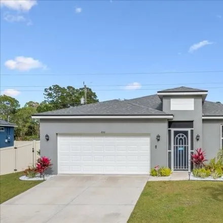 Buy this 4 bed house on 886 Kecherburg Road Southwest in Palm Bay, FL 32908
