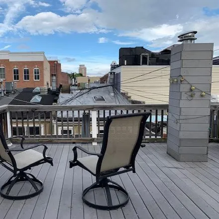 Rent this 2 bed townhouse on 1035 South Charles Street in Baltimore, MD 21230