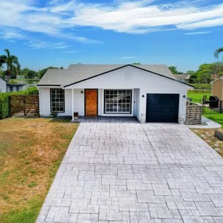 Buy this 2 bed house on 9090 Chrysanthemum Drive in Rainbow Lakes, Palm Beach County