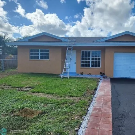 Buy this 3 bed house on 6601 Northwest 33rd Way in Palm Aire, Fort Lauderdale
