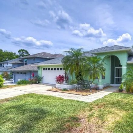 Buy this 4 bed house on 1699 Palomino Drive in Pinellas County, FL 34689