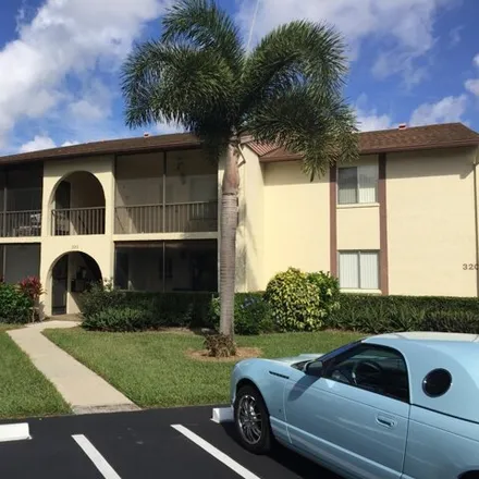 Rent this 1 bed condo on 320 Knotty Pine Cir Unit C2 in Greenacres, Florida