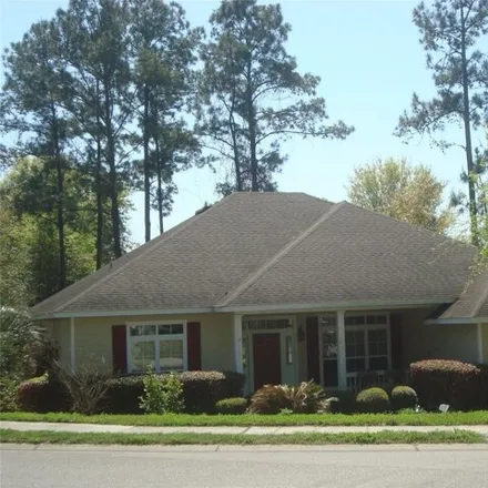 Rent this 4 bed house on 2429 NW 93rd St in Gainesville, Florida