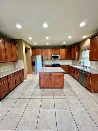 Rent this 4 bed house on 530 Honeysuckle Vine Drive in Fort Bend County, TX 77469