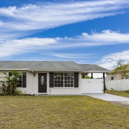 Buy this 3 bed house on 3264 Edgewood Drive Northeast in Palm Bay, FL 32905
