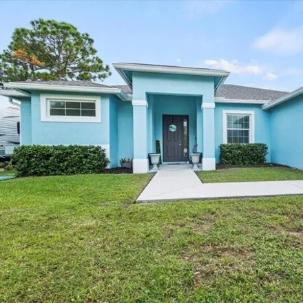 Buy this 4 bed house on 1648 Southwest Granville Avenue in Port Saint Lucie, FL 34953