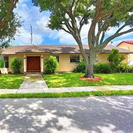 Buy this 3 bed house on 6054 Northwest Paradise Place in Tamarac, FL 33321