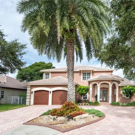 Buy this 4 bed house on 3683 West Lake Estates Drive in Davie, FL 33328