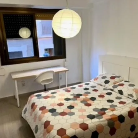 Rent this 4 bed room on Gusto. Casa Comidas para llevar in Carrer dels Carnissers, 46001 Valencia