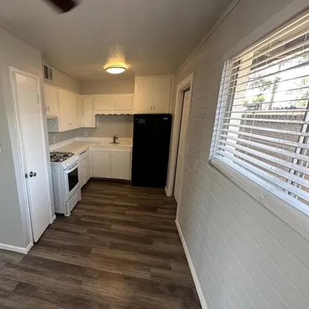 Buy this studio house on Go Family Auto Sales in 3126 West McDowell Road, Phoenix
