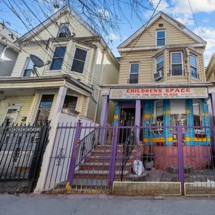 Buy this 5 bed house on 2656 Briggs Avenue in New York, NY 10458